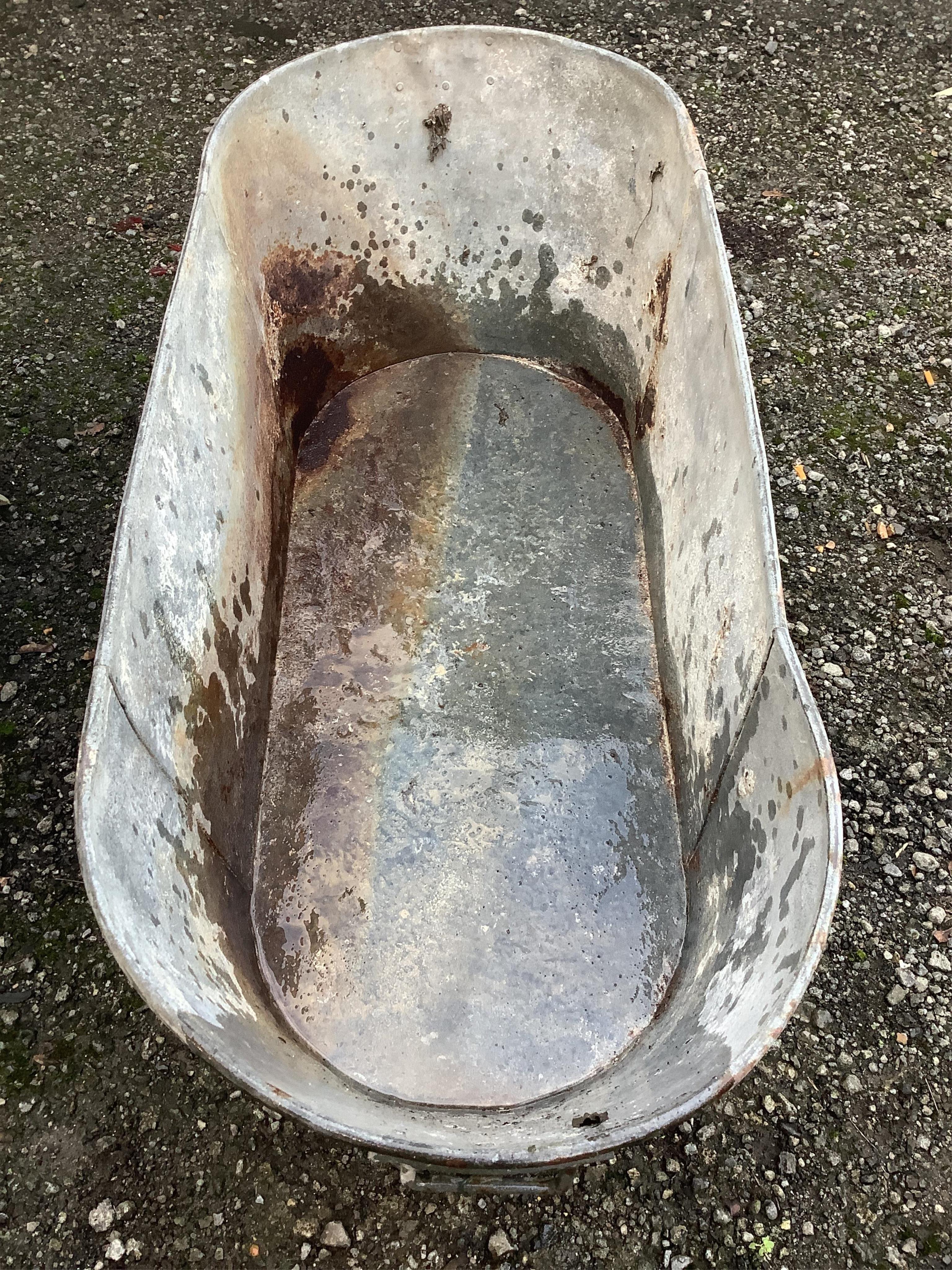 A vintage galvanised bath, width 126cm, depth 52cm, height 40cm. Condition - fair